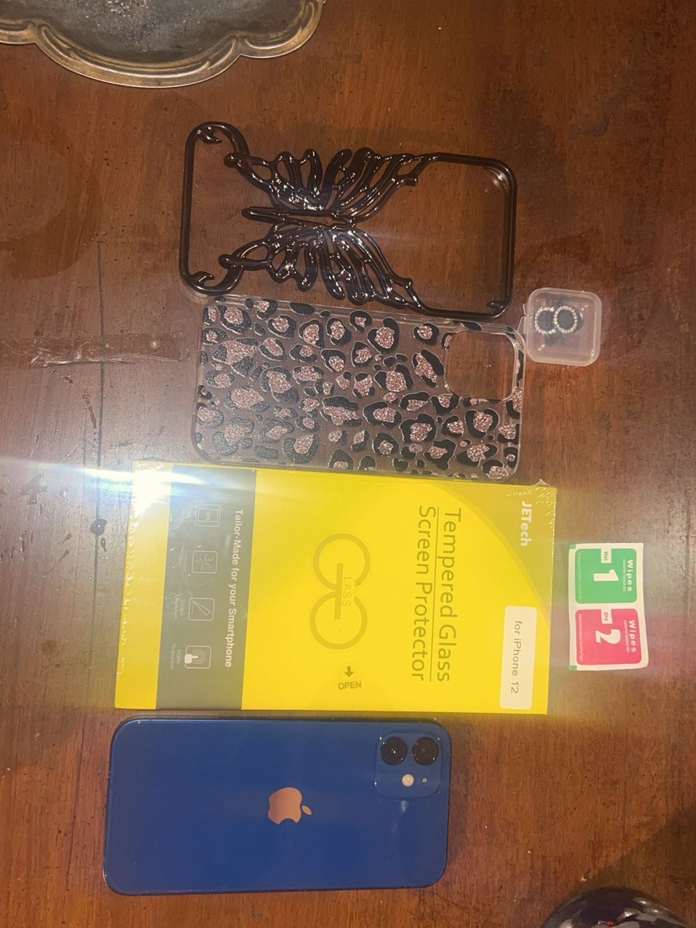 Apple Blue iPhone 12 with Blue & Black Decorative Cases and Screen Protector